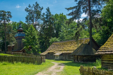 Museum of folk architecture. Presentation of rural construction in Poland. Old picturesque peasant huts. Ethnographic open-air museum. Family attraction.