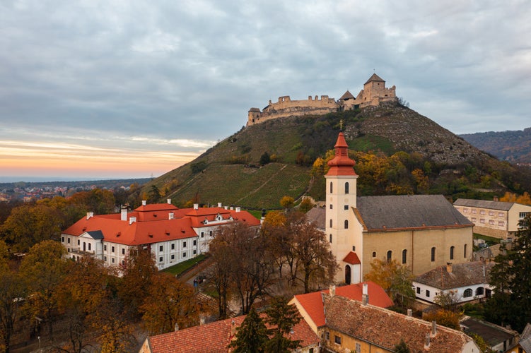 Photo of Aerial view about Bishop`s Palace under the castle of Sumeg at sunset.