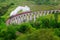 Photo of Detail of steam train on famous Glenfinnan viaduct, Scotland, United Kingdom .