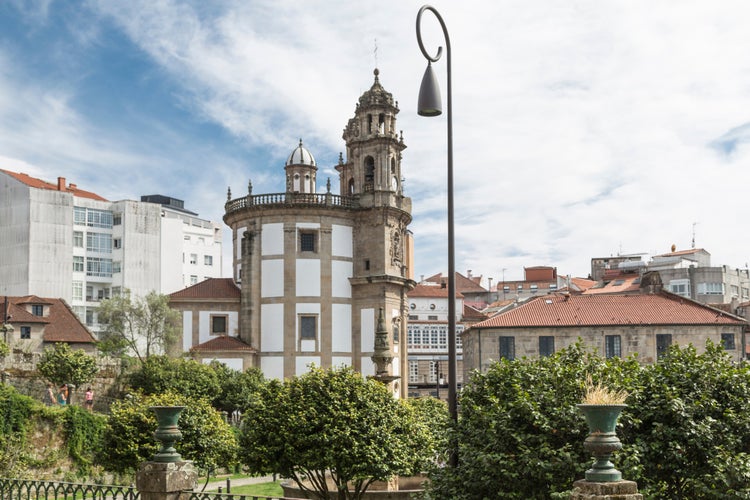 Photo of side view of the Church of the Pilgrim Virgin in Pontevedra, from the gardens of the Convent of San Francisco, Galicia, Spain.