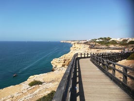 Photo of Carvoeiro fishing village with beautiful beach and colourful houses, Portugal.