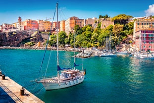 Photo of colorful houses on the shore of Bastia port, bright morning view of Corsica island, France.