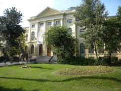 Antique building view in Old Town Bucharest city - capital of Romania and Dambrovita river. Bucharest, Romania, Europe.