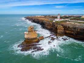 Photo of Carvoeiro fishing village with beautiful beach and colourful houses, Portugal.