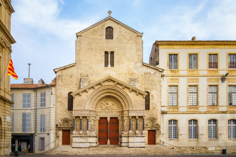 Photo of West facade of the Saint Trophime Cathedral in Arles, France.