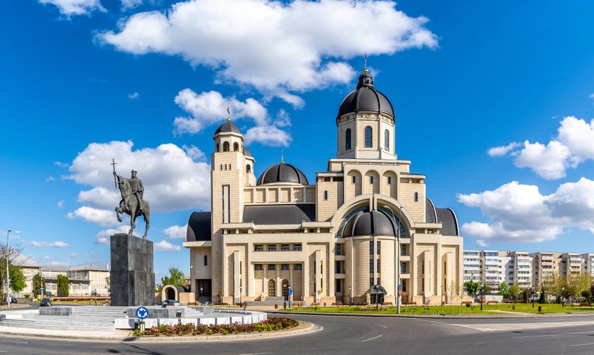 photo of view of The statue of Stefan Cel Mare and Cathedral in center of Bacau city, Moldavia landmark, Romania