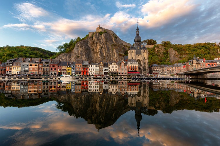 photo of view of Classic view of the historic town of Dinant with scenic River Meuse in beautiful golden evening light at sunset, province of Namur, Wallonia, Belgium