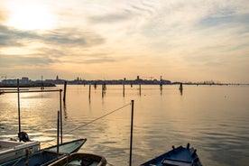 Famous buildings, gondolas and monuments by the Rialto Bridge of Venice on the Grand Canal, Italy.