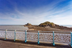 Gower-turen med mumlar Tre klippor, maskarhuvud från Cardiff