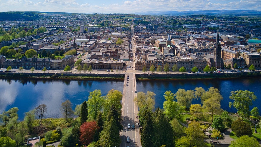 photo of view of Bridge, river and city. Perth, Scotland - May 16, 2021 Aerial shot of the Tay River Road Bridge and the city of Perth.