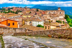 Photo of aerial view of Verona historical city centre, Ponte Pietra bridge across Adige river, Verona Cathedral, Duomo di Verona, red tiled roofs, Veneto Region, Italy.