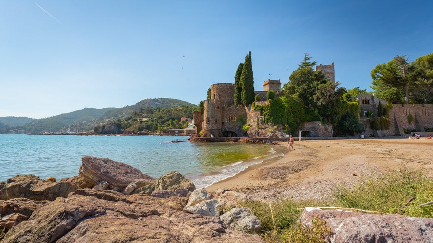 Mandelieu-la-Napoule, Alpes Maritime, French Riviera, South of France Vector with blue sea, 14th century castle, boats, mountains and apartment buildings