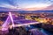 Photo of illuminated Millennium bridge in the city center, under colorful sunset sky, Podgorica, Montenegro, at night.