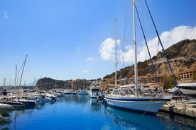 Photo of aerial panoramic view coastline and La Vila Joiosa Villajoyosa touristic resort townscape, sandy beach and Mediterranean seascape, Costa Blanca, Spain.