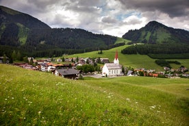 Photo of a view of the Alps from the Ehrwald, a town on the border of Germany and Austria with picturesque meadows surrounded by towering mountain ranges, including the Zugspitze.