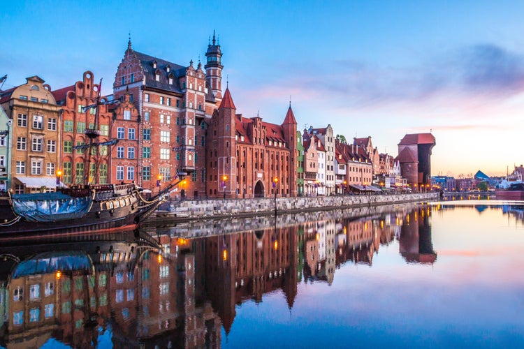 Photo of panorama of the facades of old medieval houses on the promenade in Gdansk, Poland.