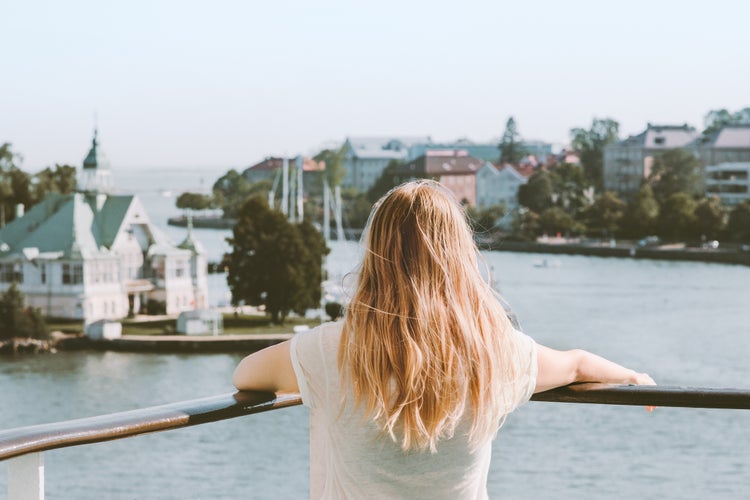 Photo of woman sightseeing Helsinki city landmarks, Finland.