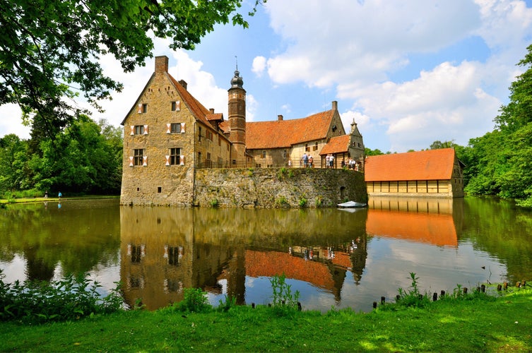 Photo of Stunning landscape castle in the middle of water in Munster Germany.