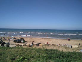 Photo of aerial view of the long sandy beach of Sword beach in Hermanville-sur-Mer towards Ouistreham ,France.