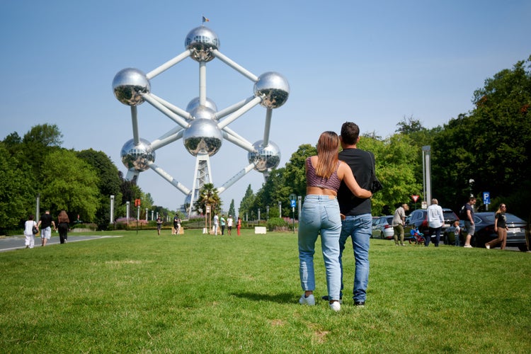 young-hispanic-couple-looking-at-atomium-brussels-2023-11-27-05-35-34-utc.jpg