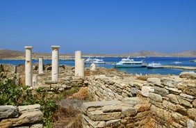 Photo of panoramic aerial view of the popular Platis Gialos beach on the Greek island of Mykonos with turquoise sea, Greece.