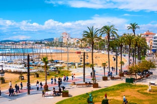 Photo of Sand beach and historical Old Town in mediterranean resort Sitges near Barcelona, Costa Dorada, Catalonia, Spain.