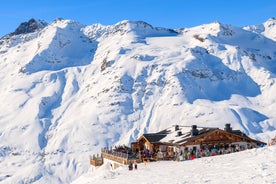 Photo of The mountain village at the Austrian ski resort Soelden on a cold and sunny winter day.