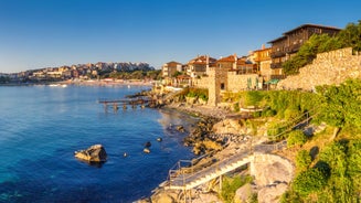 Photo of panoramic aerial view over small ancient resort town of Pomorie with old European small houses , Bulgaria.