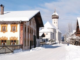 photo of Unterammergau town in beautiful autumnal nature and blue sky with clouds in Bavaria, Germany.