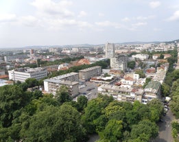 Photo of aerial view of The Cathedral of the Assumption and Varna city at amazing sunset, Bulgaria.