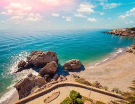 Photo of aerial view of the town of Nerja with the beautiful beach, Málaga, one of the white villages of Andalusia, Spain.