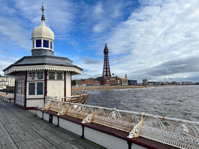 photo of Blackpool tower, promenade and beach view from north pier in England.