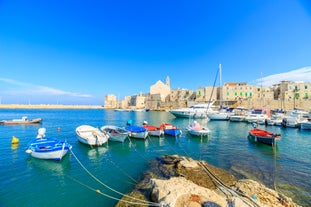 Photo of panoramic view of the ancient town of Matera (Sassi di Matera), European Capital of Culture 2019, in beautiful golden morning light with blue sky and clouds, Basilicata, southern Italy.