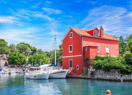 Photo of Fisherman's red house on the water, Croatia, Zadar.
