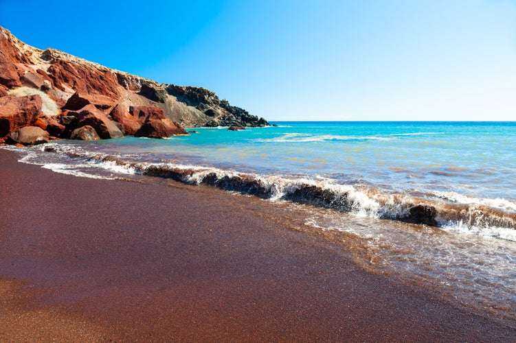 Photo of beautiful scenery of red sand beach in Akrotiri village ,Santorini ,Greece.