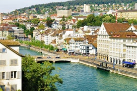 Panoramic view of historic Zurich city center with famous Fraumunster, Grossmunster and St. Peter and river Limmat at Lake Zurich on a sunny day with clouds in summer, Canton of Zurich, Switzerland