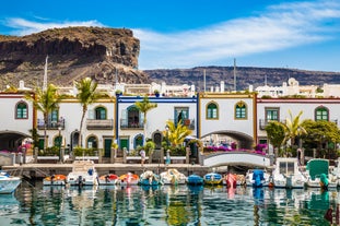 photo of landscape with Maspalomas town and golden sand dunes at sunrise, Gran Canaria, Canary Islands, Spain.