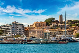 Photo of aerial cityscape view on French riviera with yachts in Cannes city, France.