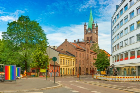 View of a street in Oslo and Greenland Church (Grønland Kirke) on Pride parade days, Norway.