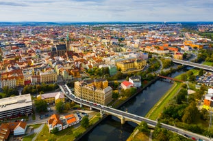 Photo of Lednice Chateau with beautiful gardens and parks on a sunny summer day, Czech Republic.