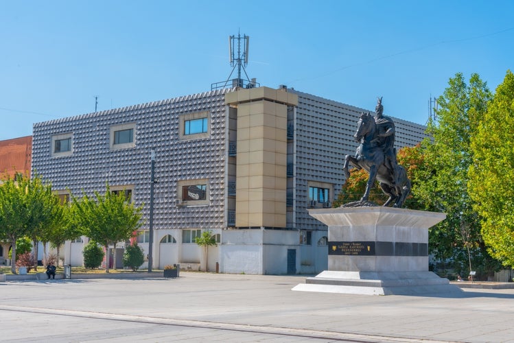 Photo of governmental building and Statue of Gjergj Kastrioti known as Skanderbeg in Prishtina, Kosovo.