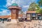 Photo of Bascarsija square with Sebilj wooden fountain in Old Town Sarajevo , Bosnia and Herzegovina.