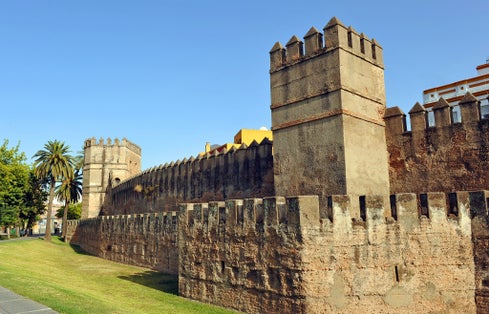 Photo of Ancient medieval walls in the district of Macarena, Seville, Spain .
