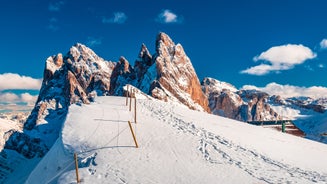 photo of Ski Resort of Corvara on a sunny day, Alta Badia, Dolomites Alps, Italy.