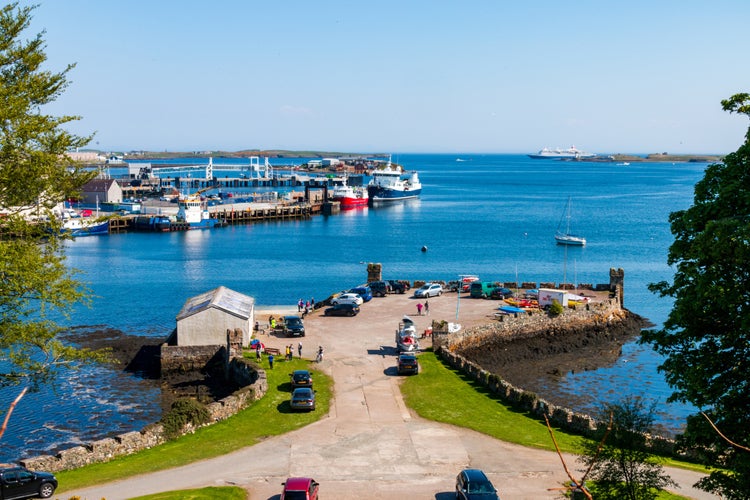 photo of Stornoway Harbor on the Isle of Lewis in Scotland in the sun.