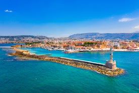 Photo of aerial view of Chania with the amazing lighthouse, mosque, venetian shipyards, Crete, Greece.