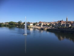 photo of the Bergerac town from bridge over Dordogne River in France.