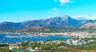 Photo of aerial view of the harbour of Port de Pollença, a seaside village located on the northern coast of Mallorca in the Balearic Islands, Spain.