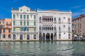 Famous buildings, gondolas and monuments by the Rialto Bridge of Venice on the Grand Canal, Italy.