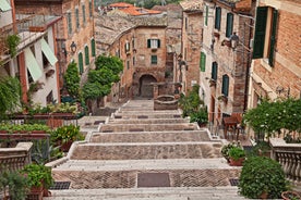 Photo of aerial view of Verona historical city centre, Ponte Pietra bridge across Adige river, Verona Cathedral, Duomo di Verona, red tiled roofs, Veneto Region, Italy.